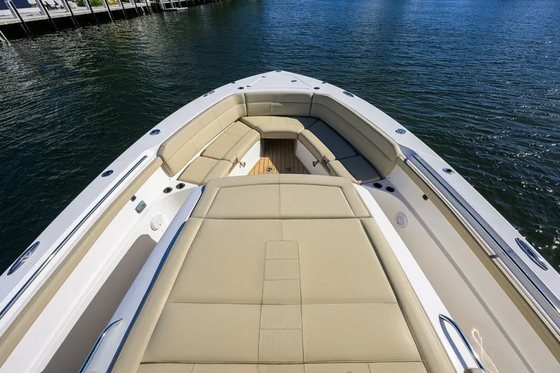 Leap Year Yacht Photos Pics 2018 Pursuit S 408 Sport boat with spacious seating on calm water.