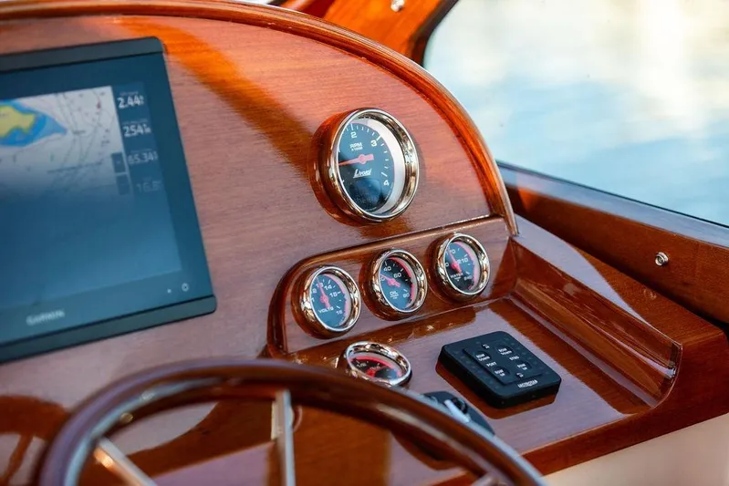Ruth Ann Yacht Photos Pics 2023 Hinckley Picnic Boat 34 S dashboard with gauges and navigation screen.
