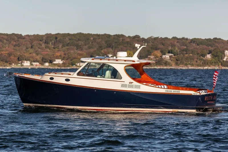 Ruth Ann Yacht Photos Pics 2023 Hinckley Picnic Boat 34 S cruising on a scenic lake.