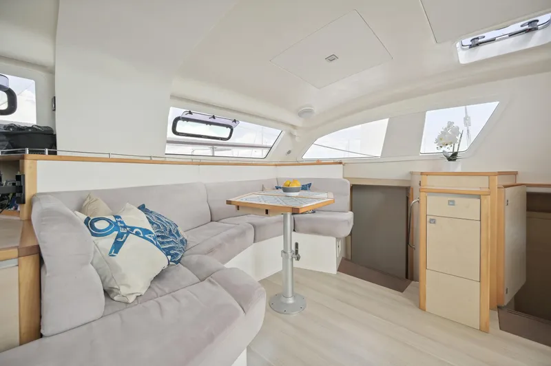 Zephyr Yacht Photos Pics Spacious interior of 2016 Catana 42 yacht with cozy seating and modern design.