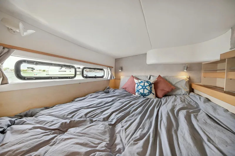 Zephyr Yacht Photos Pics Cozy bedroom in 2016 Catana 42 catamaran with nautical-themed decor.