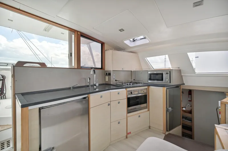 Zephyr Yacht Photos Pics Modern kitchen interior of 2016 Catana 42 catamaran with sleek appliances and ample storage.