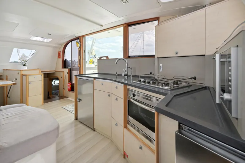 Zephyr Yacht Photos Pics Modern kitchen interior of 2016 Catana 42 catamaran with sleek design and appliances.