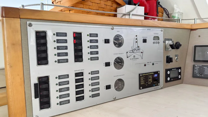 Zephyr Yacht Photos Pics Control panel of a 2016 Catana 42 catamaran, featuring switches and gauges.