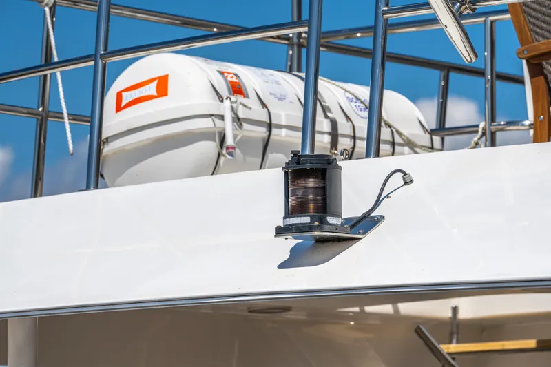  Yacht Photos Pics Close-up of 2005 Pacific Mariner 85 Motor Yacht with life raft and winch.