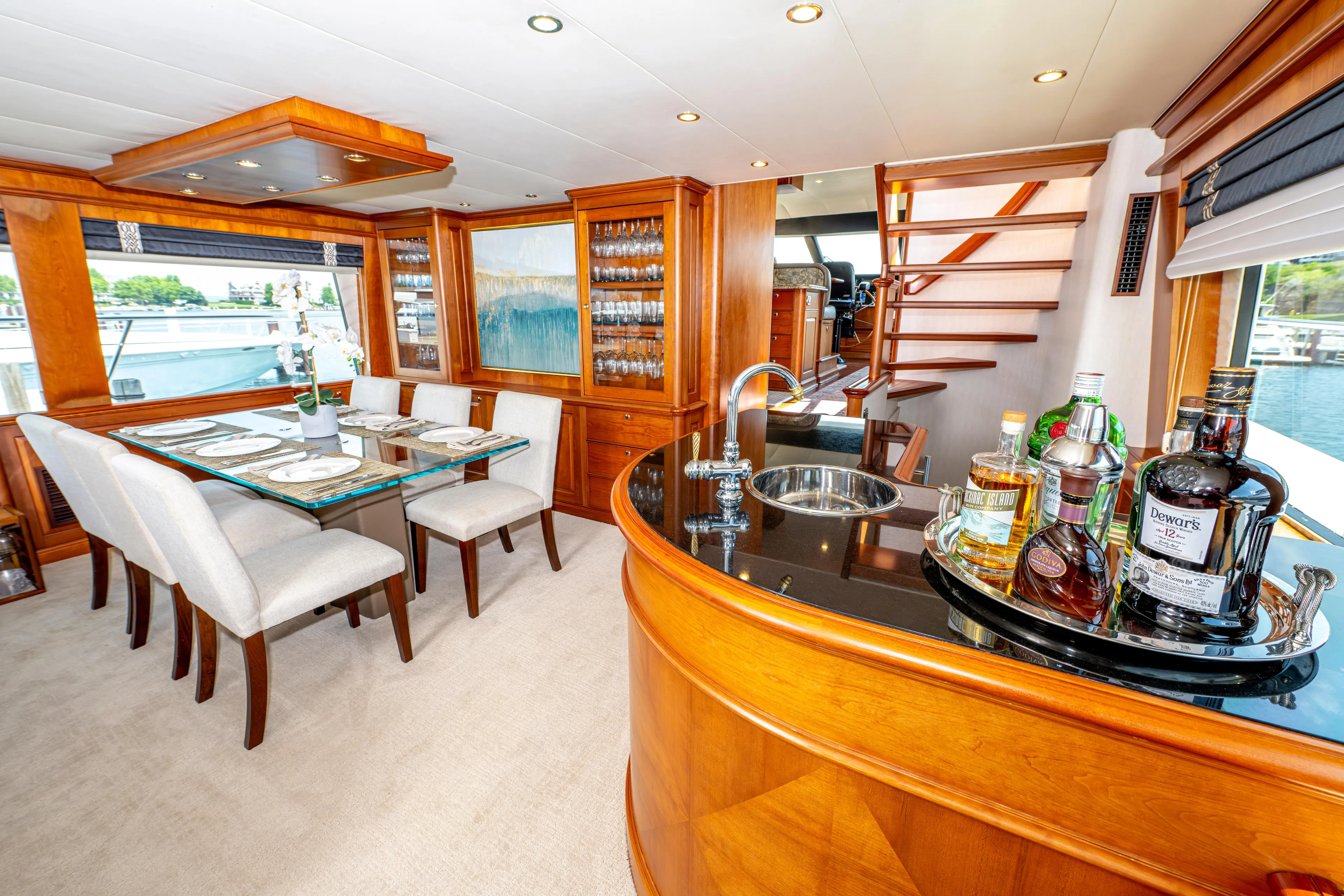  Yacht Photos Pics Luxurious interior of a 2005 Pacific Mariner 85 Motor Yacht with dining area and bar.
