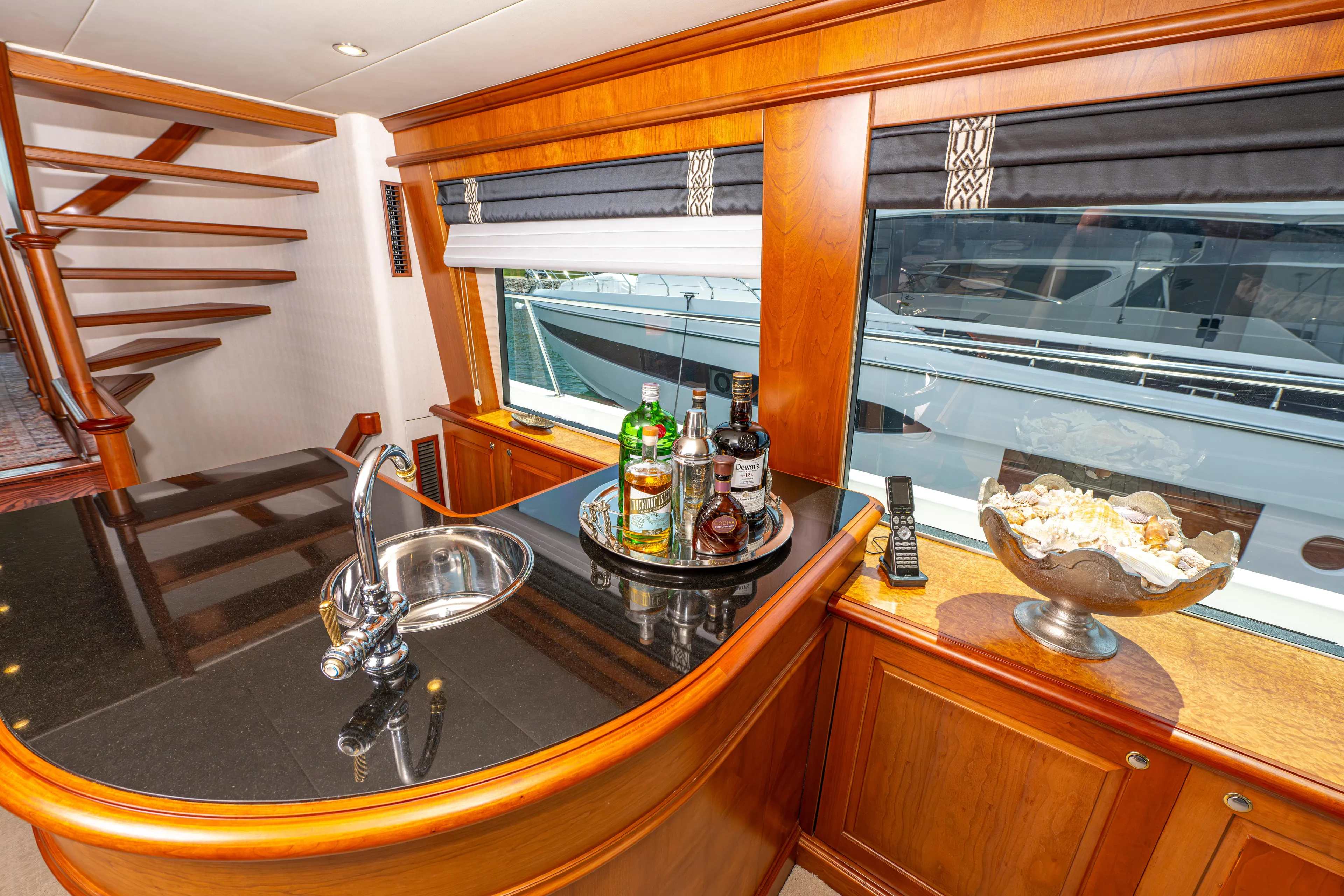  Yacht Photos Pics Luxurious bar area in a 2005 Pacific Mariner 85 Motor Yacht with a sleek countertop.