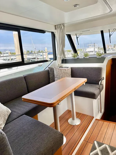  Yacht Photos Pics Interior of 2021 Beneteau Swift Trawler 41 Fly with modern seating and table.