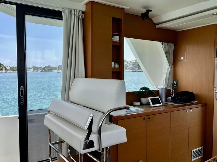  Yacht Photos Pics Interior of 2021 Beneteau Swift Trawler 41 Fly with elegant seating and scenic water view.