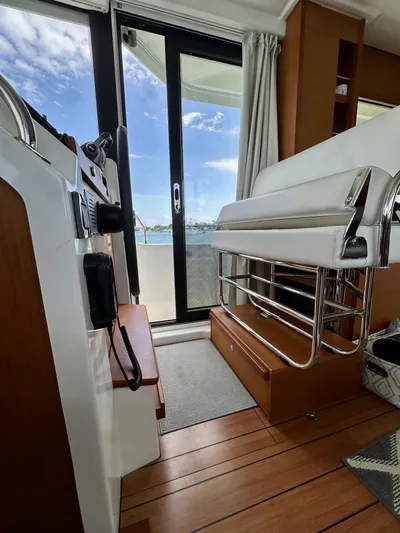  Yacht Photos Pics Interior view of 2021 Beneteau Swift Trawler 41 Fly, featuring modern design and wooden flooring.