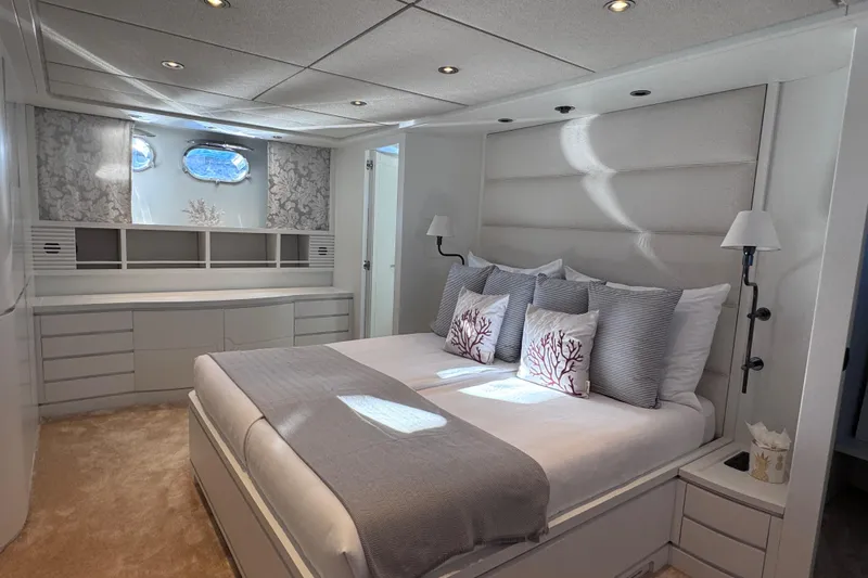  Yacht Photos Pics Luxurious Sanlorenzo SL88 yacht bedroom, elegant decor, soft lighting, and plush bedding, 2000 model.
