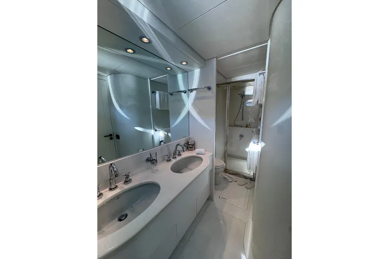  Yacht Photos Pics Luxurious bathroom in 2000 Sanlorenzo SL88 yacht with dual sinks and modern shower.