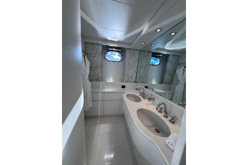  Yacht Photos Pics Luxurious bathroom in 2000 Sanlorenzo SL88 yacht with dual sinks and elegant design.