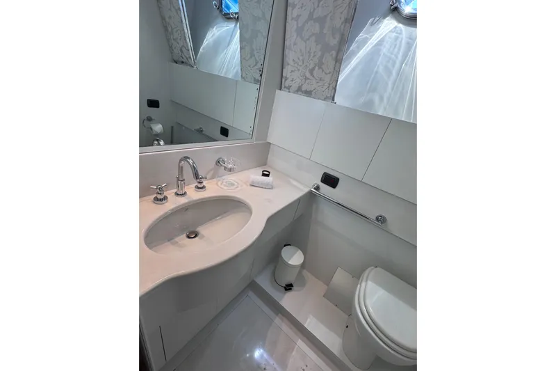  Yacht Photos Pics Luxurious bathroom in 2000 Sanlorenzo SL88 yacht, featuring modern fixtures and elegant design.