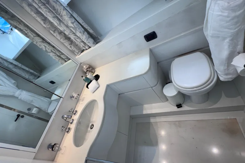  Yacht Photos Pics Luxurious bathroom on 2000 Sanlorenzo SL88 yacht, featuring modern fixtures and elegant design.