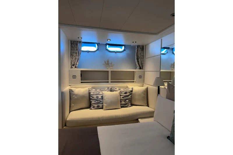  Yacht Photos Pics Luxurious interior of 2000 Sanlorenzo SL88 yacht with cozy seating and nautical decor.