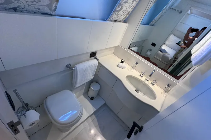  Yacht Photos Pics Luxurious bathroom in 2000 Sanlorenzo SL88 yacht with modern fixtures and elegant design.