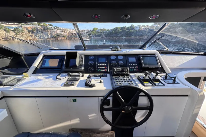  Yacht Photos Pics Cockpit of 2000 Sanlorenzo SL88 yacht with navigation controls and scenic view.