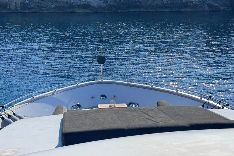  Yacht Photos Pics Bow view of 2000 Sanlorenzo SL88 yacht on sparkling blue water.