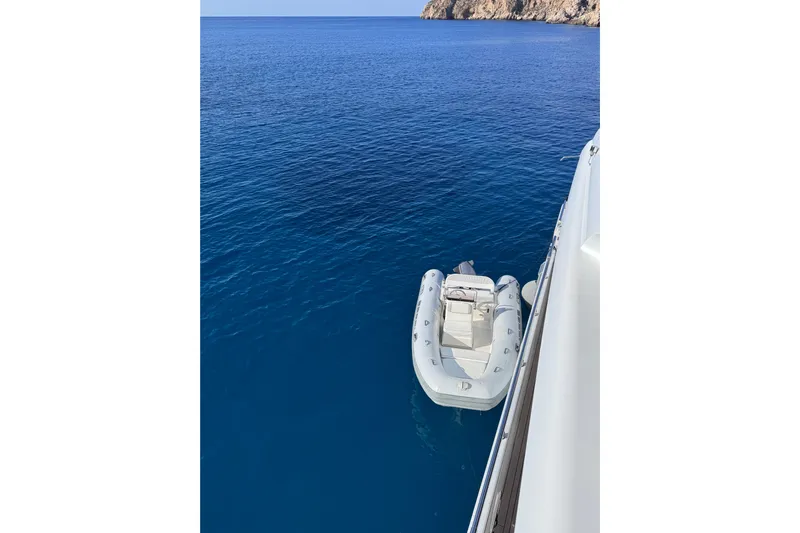  Yacht Photos Pics Sanlorenzo SL88 yacht with inflatable boat on clear blue sea, 2000 model.