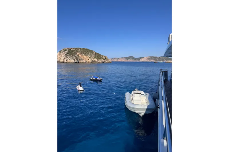  Yacht Photos Pics Sanlorenzo SL88 yacht with jet skis and island view, 2000 model.