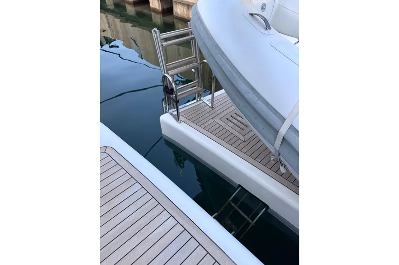  Yacht Photos Pics Sanlorenzo SL88 yacht, 2000 model, featuring a teak deck and ladder by the water.