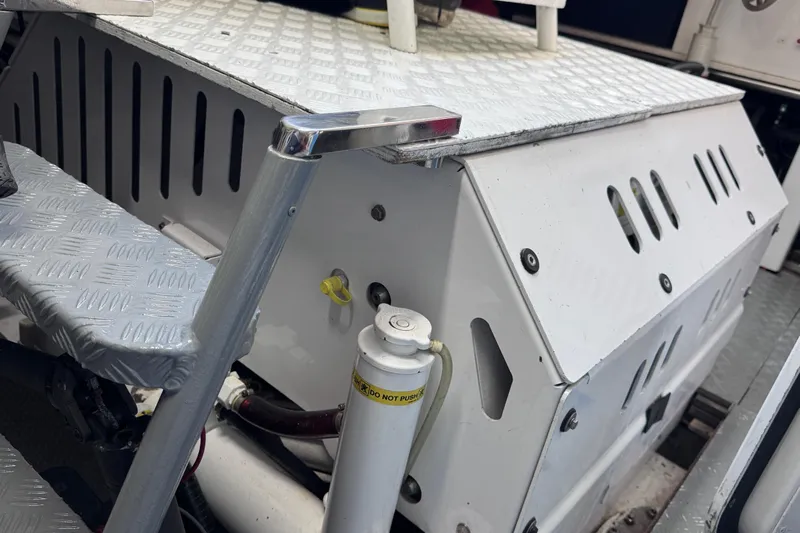  Yacht Photos Pics Engine compartment of 2000 Sanlorenzo SL88 yacht, featuring metal steps and hydraulic components.