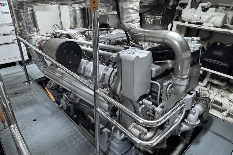  Yacht Photos Pics Engine room of 2000 Sanlorenzo SL88 yacht, showcasing complex machinery and piping.