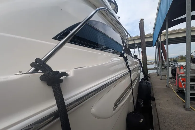 High Flyer Yacht Photos Pics 2007 Meridian 411 Sedan Bridge yacht docked at marina, side view.