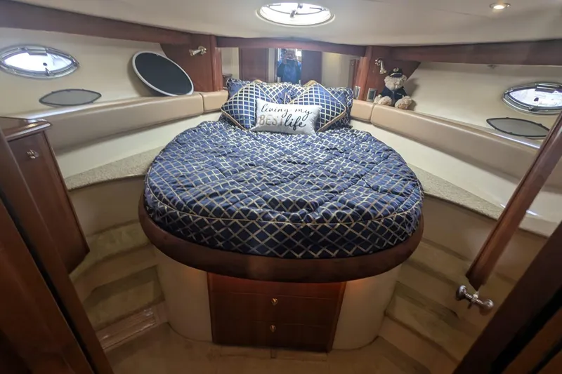 High Flyer Yacht Photos Pics Luxurious 2007 Meridian 411 Sedan Bridge cabin with cozy bed and nautical decor.