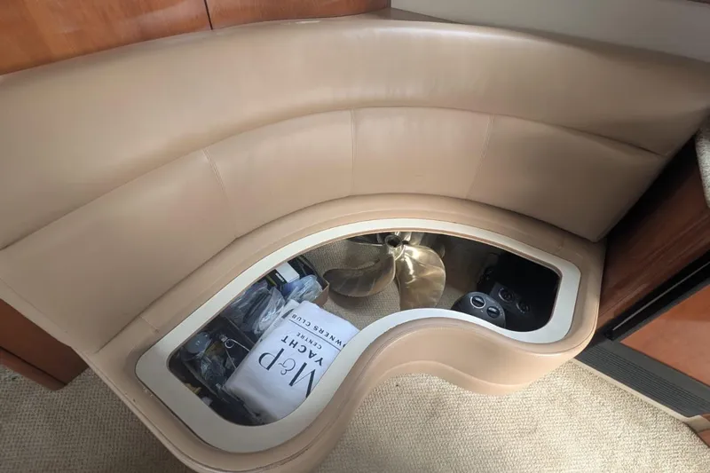 High Flyer Yacht Photos Pics Luxurious interior seating of 2007 Meridian 411 Sedan Bridge yacht with storage compartment.