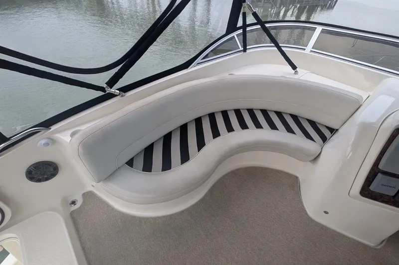 High Flyer Yacht Photos Pics 2007 Meridian 411 Sedan Bridge interior with curved seating and striped cushions.