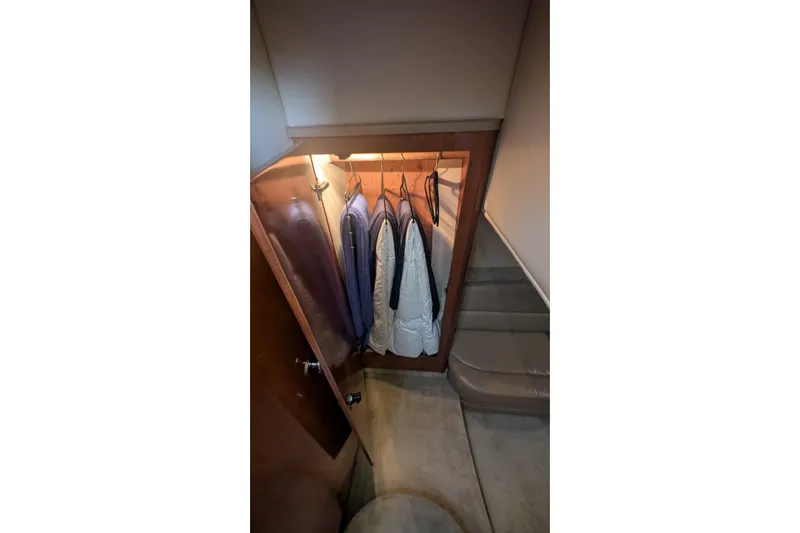 High Flyer Yacht Photos Pics Closet interior on 2007 Meridian 411 Sedan Bridge yacht with hanging clothes.
