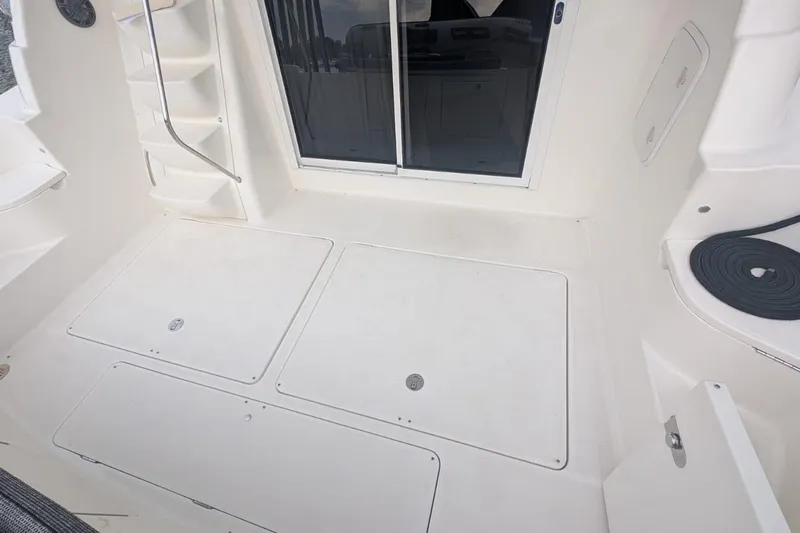 High Flyer Yacht Photos Pics 2007 Meridian 411 Sedan Bridge boat deck with storage hatches and sliding door.