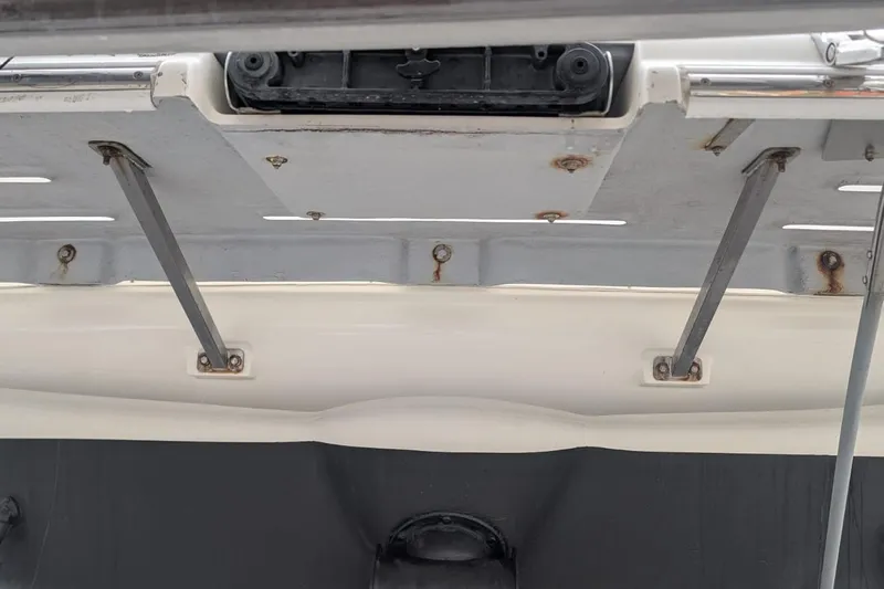 High Flyer Yacht Photos Pics 2007 Meridian 411 Sedan Bridge boat hatch with metal support struts and visible rust.