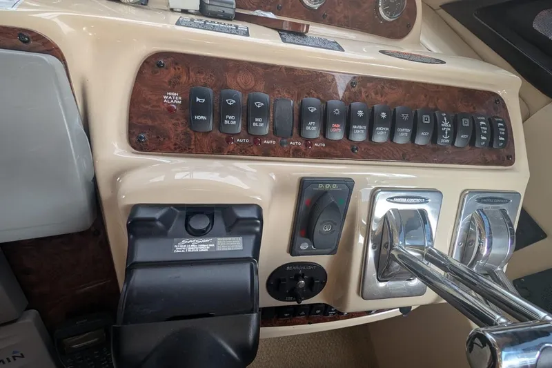 High Flyer Yacht Photos Pics Control panel of 2007 Meridian 411 Sedan Bridge yacht with various switches and levers.