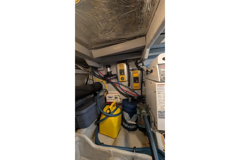 High Flyer Yacht Photos Pics Engine room of 2007 Meridian 411 Sedan Bridge with wiring and maintenance equipment.