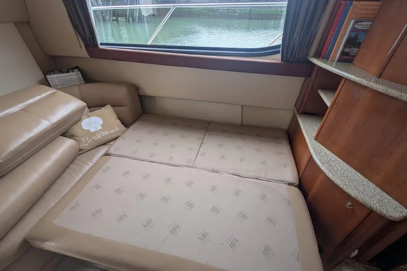 High Flyer Yacht Photos Pics Interior of 2007 Meridian 411 Sedan Bridge with beige seating and window view.