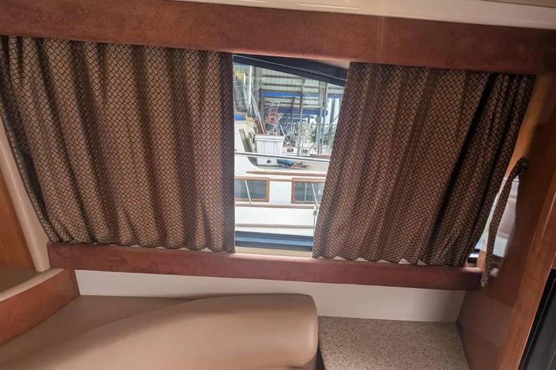 High Flyer Yacht Photos Pics Interior view of 2007 Meridian 411 Sedan Bridge with window and curtains.