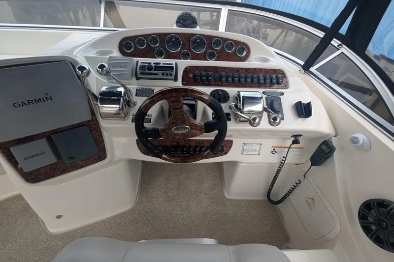 High Flyer Yacht Photos Pics Cockpit of 2007 Meridian 411 Sedan Bridge with Garmin navigation system and control panel.