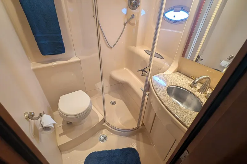 High Flyer Yacht Photos Pics Luxurious bathroom in 2007 Meridian 411 Sedan Bridge yacht with shower and sink.