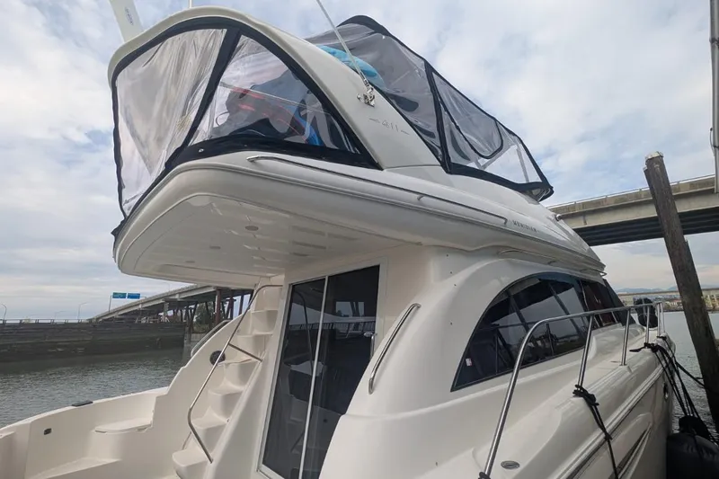 High Flyer Yacht Photos Pics 2007 Meridian 411 Sedan Bridge yacht docked, showcasing sleek design and upper deck enclosure.
