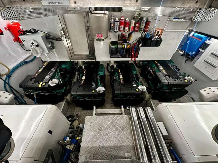  Yacht Photos Pics Engine room of 2009 Conam 65 Flybridge yacht with multiple engines and equipment.