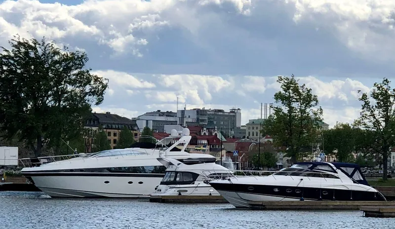  Yacht Photos Pics Luxury yachts docked at a marina, featuring a 2009 Conam 65 Flybridge.