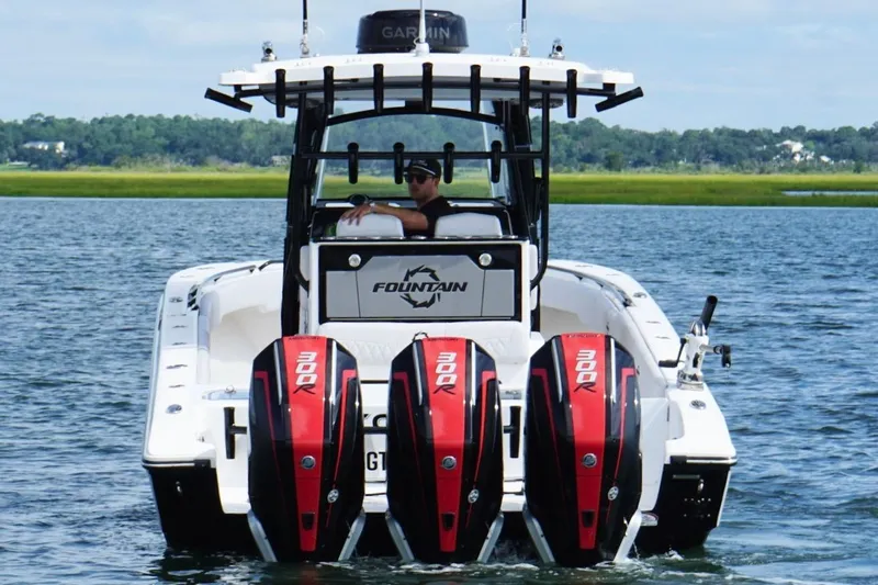  Yacht Photos Pics 2024 Fountain 34 TE boat with quad 300R engines on a scenic waterway.