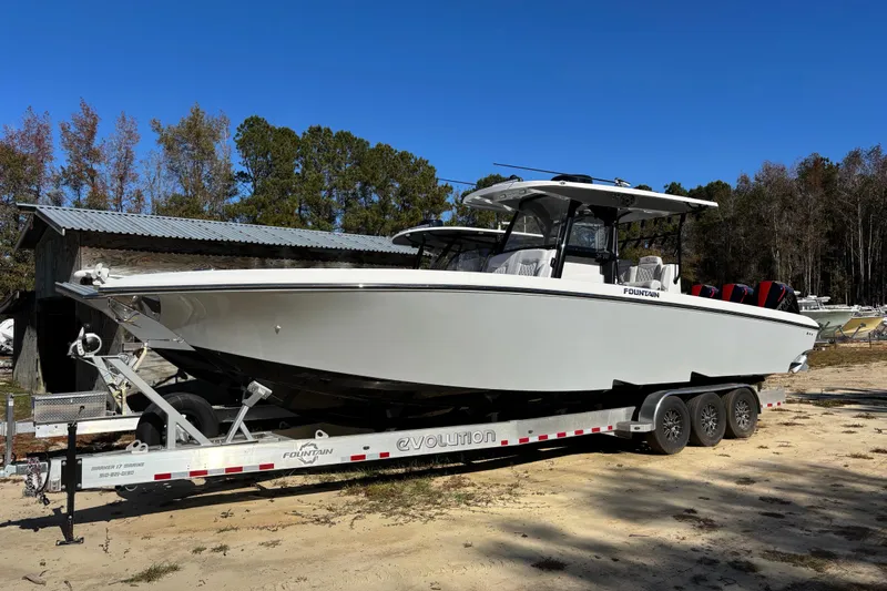  Yacht Photos Pics 2024 Fountain 34 Tournament Edition boat on trailer, parked outdoors.