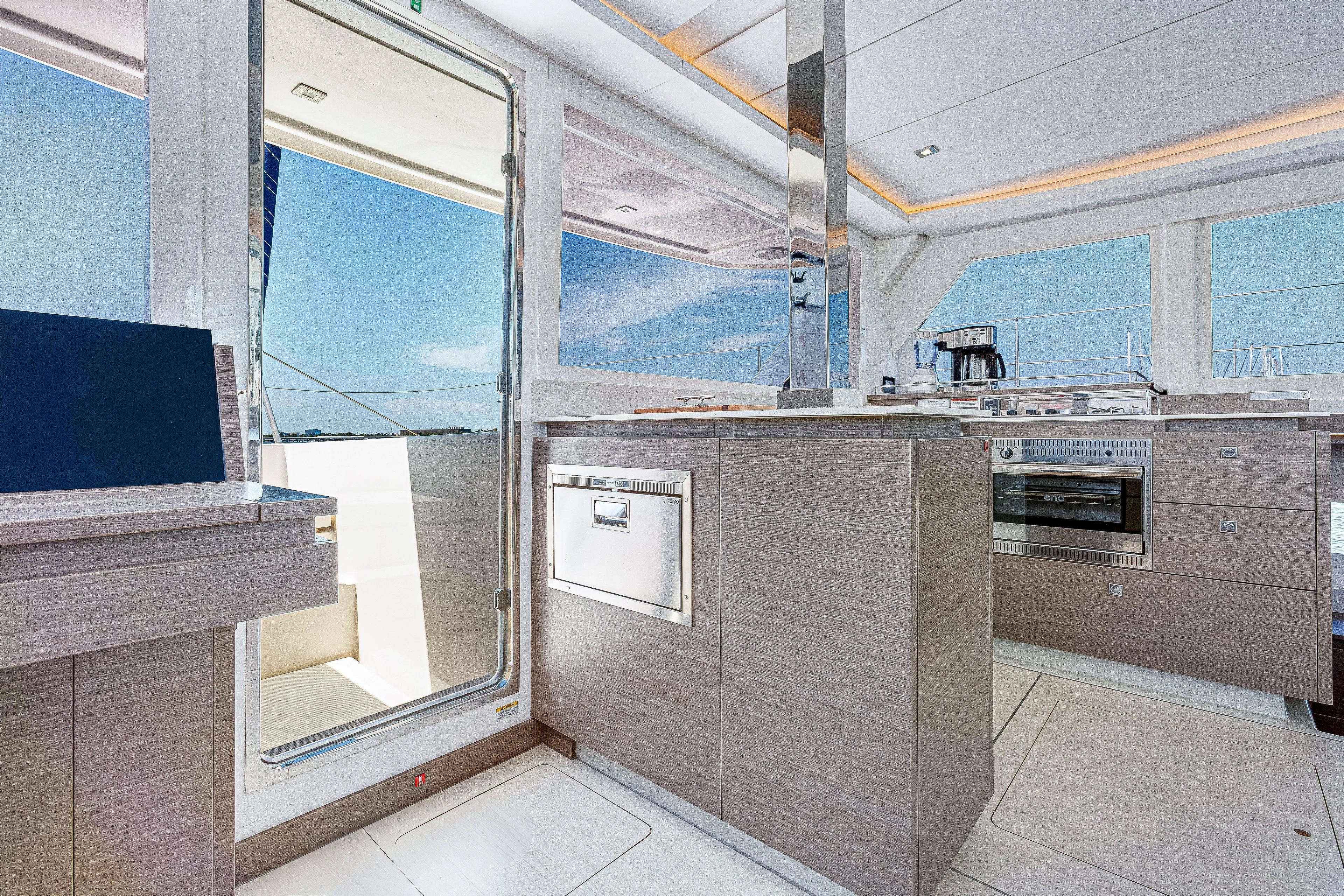 Limerick Yacht Photos Pics Modern kitchen interior of 2023 Leopard 42 yacht with sleek design and ocean view.
