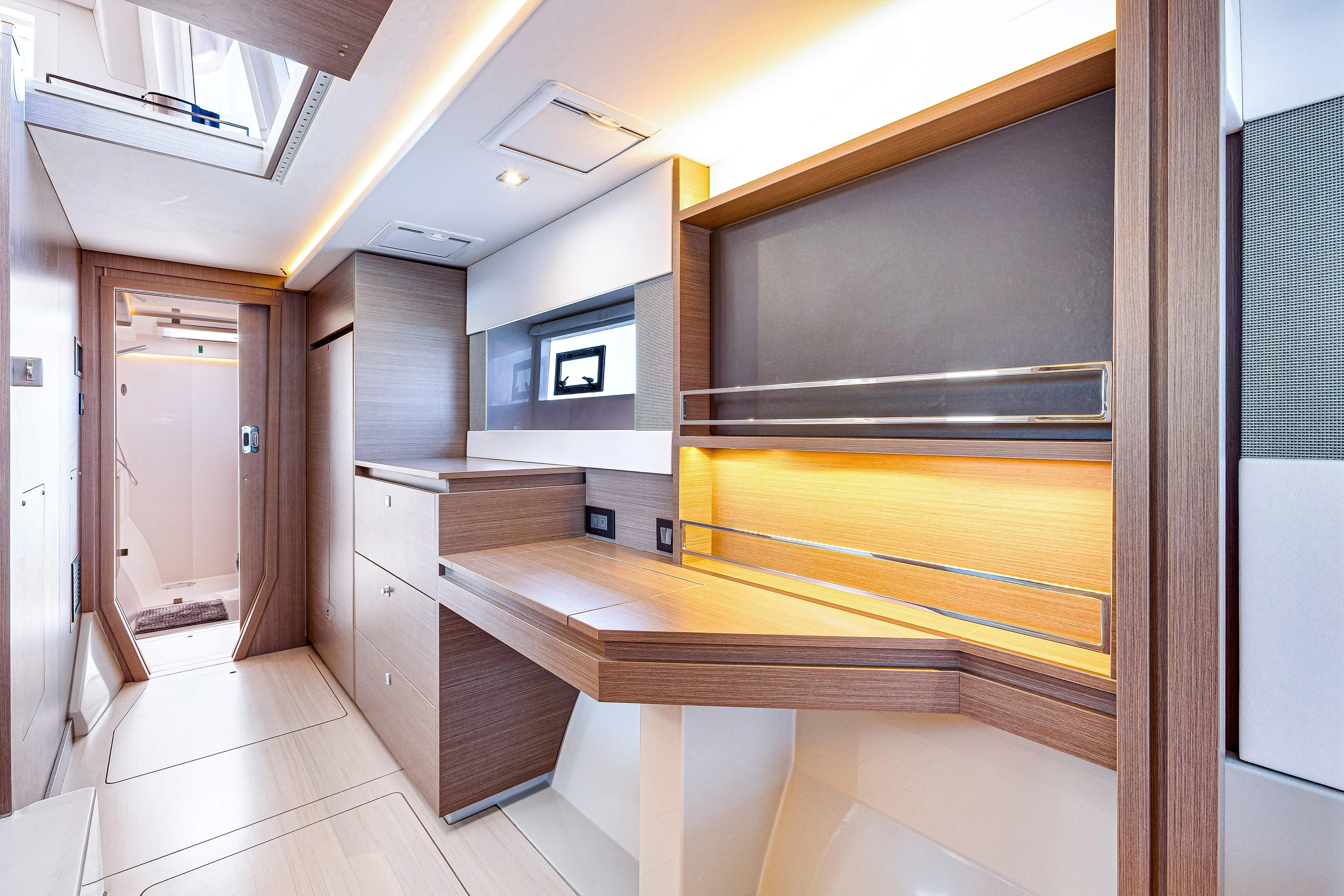 Limerick Yacht Photos Pics Luxurious interior of 2023 Leopard 42 yacht with modern wood finishes and ambient lighting.