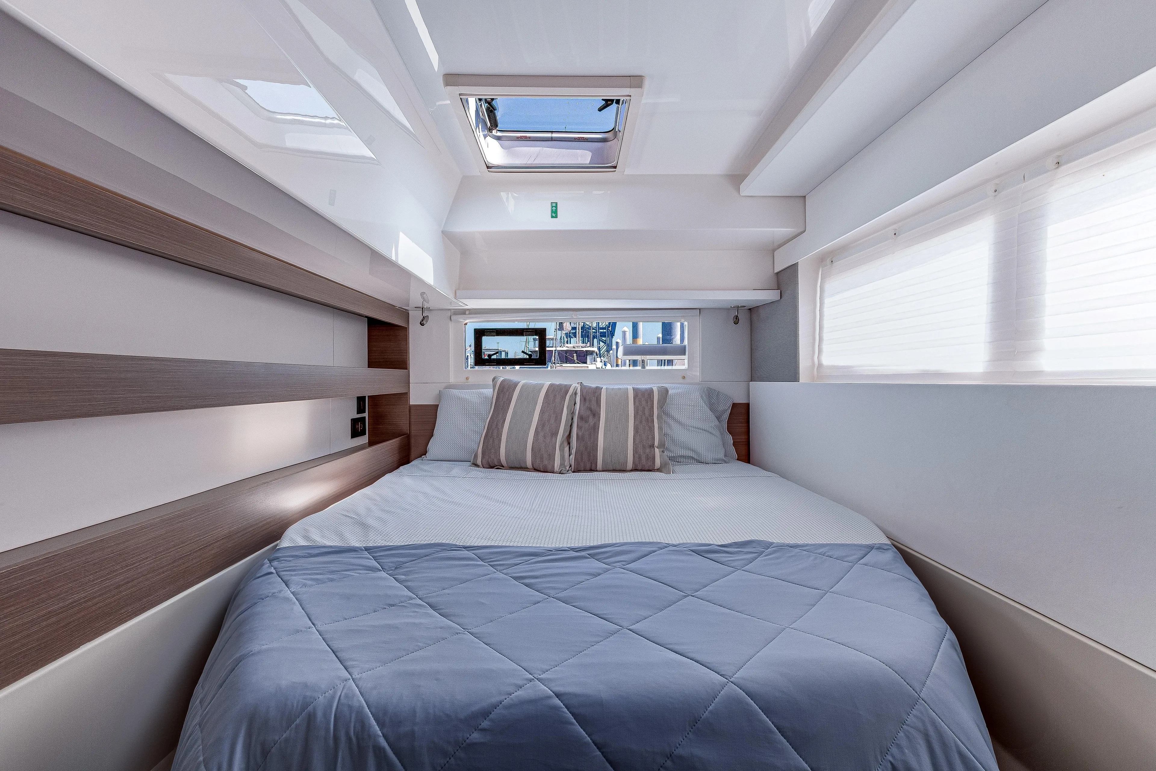 Limerick Yacht Photos Pics Luxurious cabin interior of 2023 Leopard 42 yacht with skylight and cozy bedding.