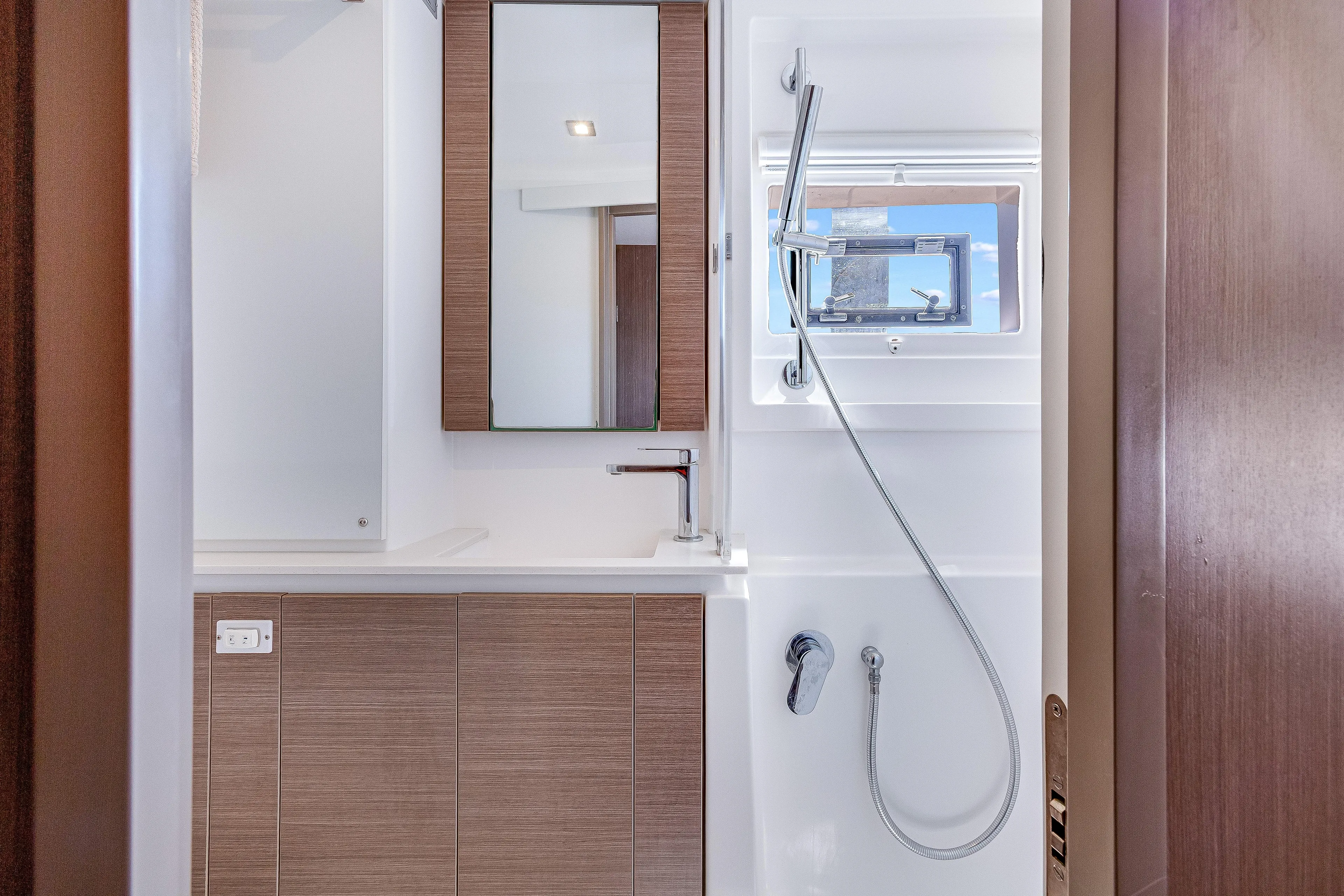 Limerick Yacht Photos Pics Modern bathroom in 2023 Leopard 42 yacht with sleek fixtures and wood accents.